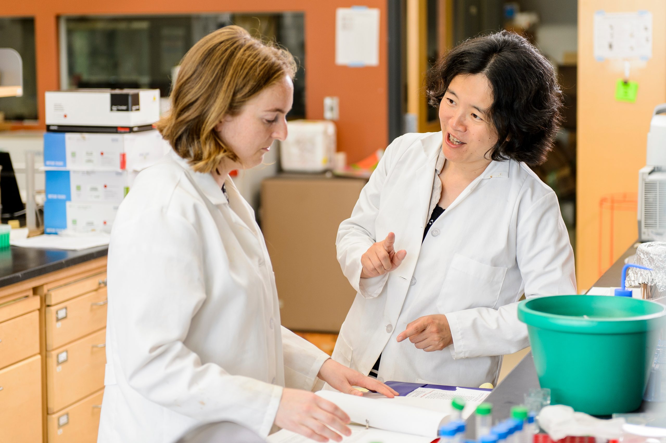 Dr. Jade Wang works with MDTP student Christina Johnson in lab.
